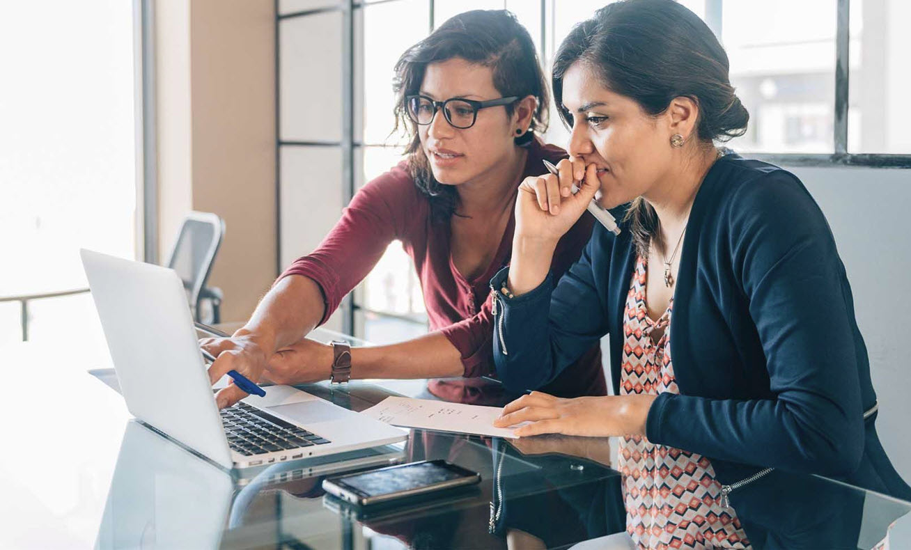 Two female colleagues working on a nonprofit executive search